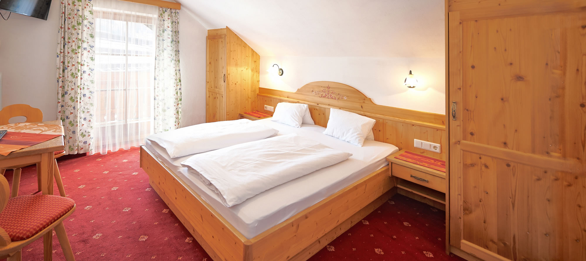 Traditionally furnished rooms at Guesthouse Schrempfgut